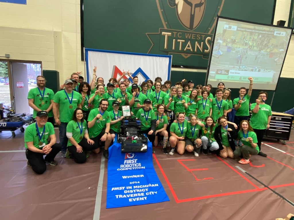 TC Titans robotics team celebrate their win.